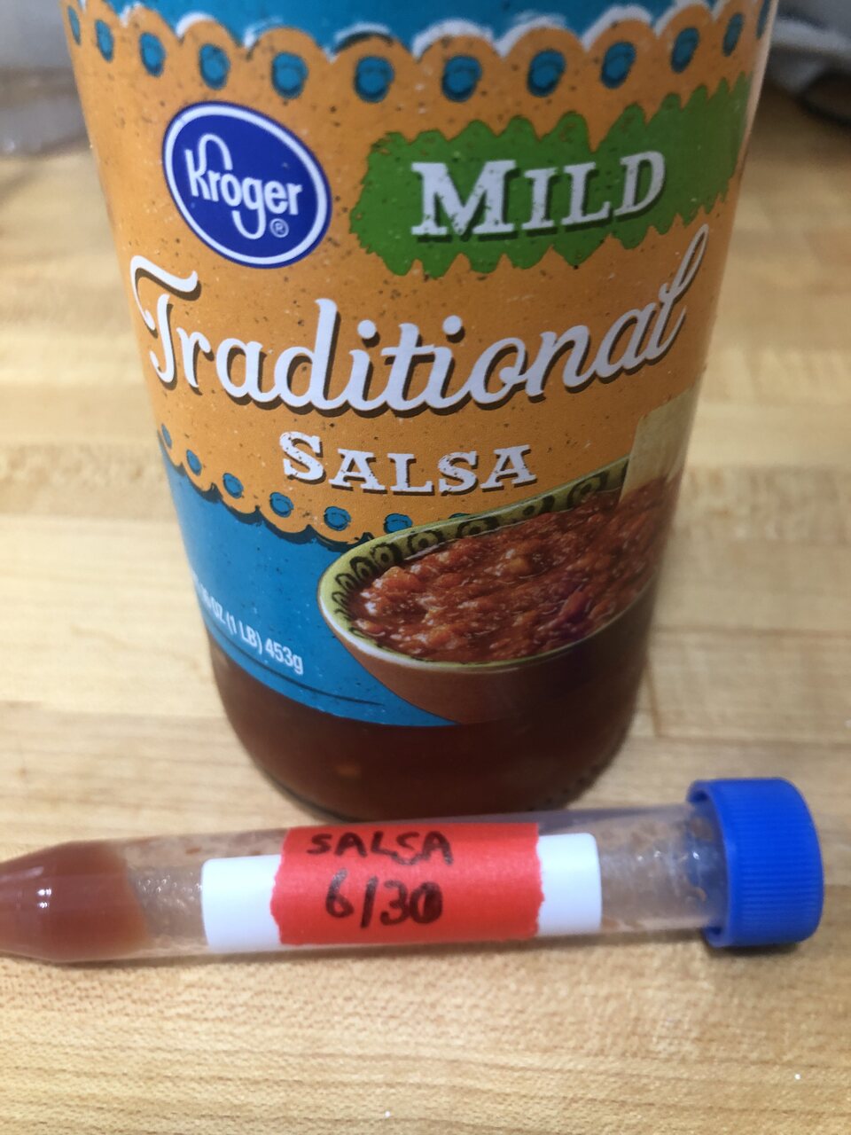 Jar of Kroger mild traditional salsa with a labelled sample tube (SALSA 6/30) in front.